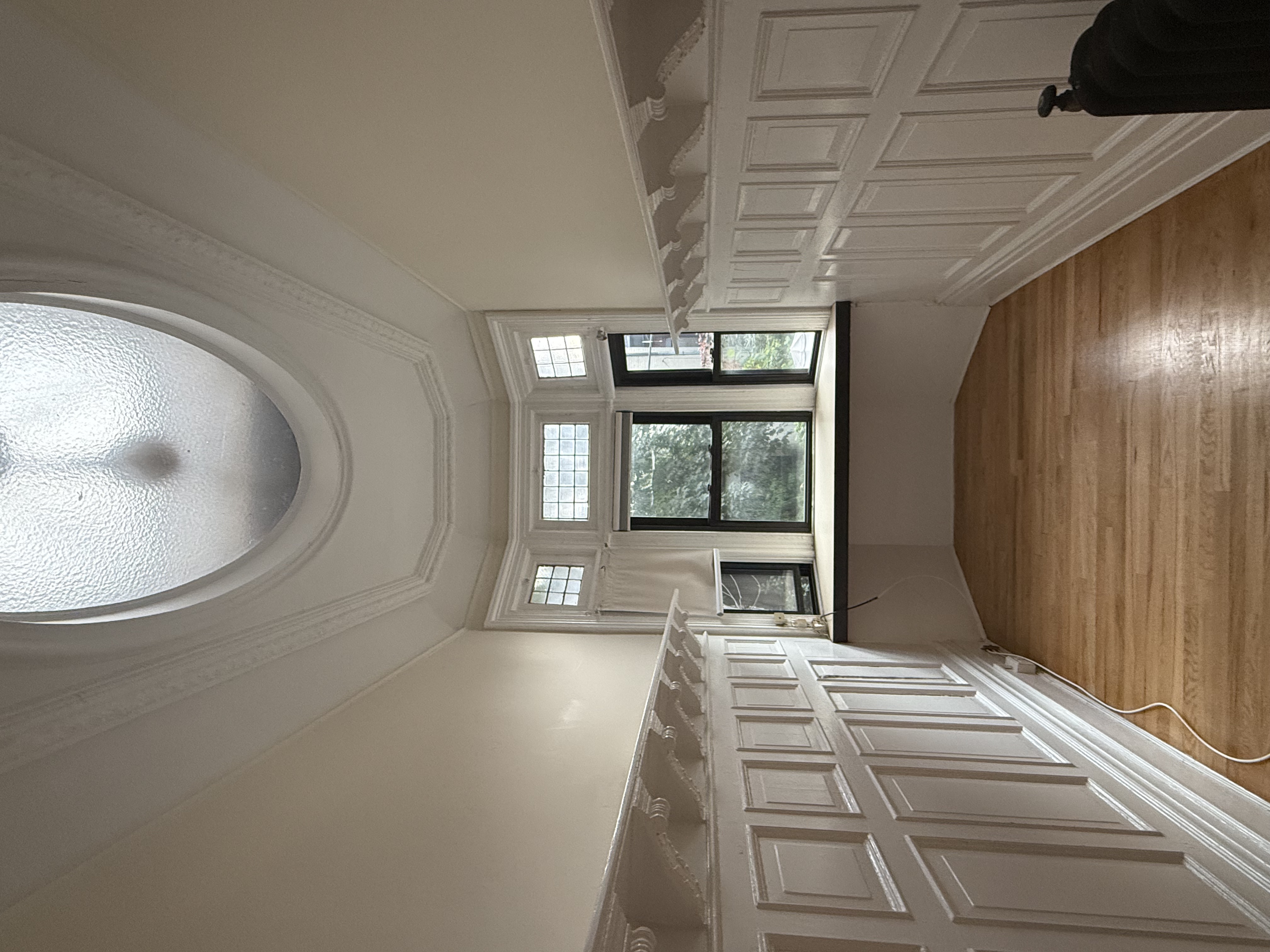 30 Montgomery Place, Unit 2 Brooklyn, NY 11215 - Photo 8 of 17 wooden floor in an empty room with a window