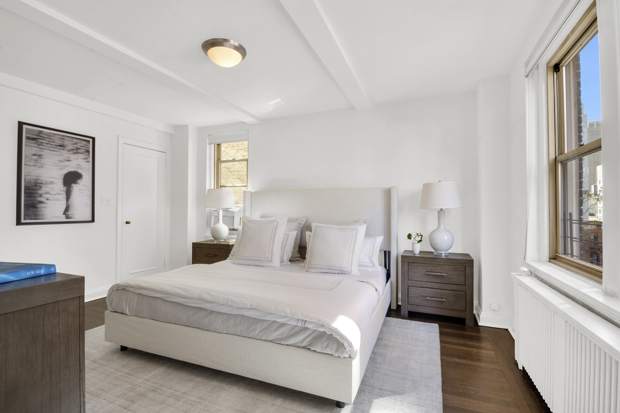 59 West 12th Street, Unit 6A Manhattan, NY 10011 - Photo 8 of 11 a bedroom with a bed and a window