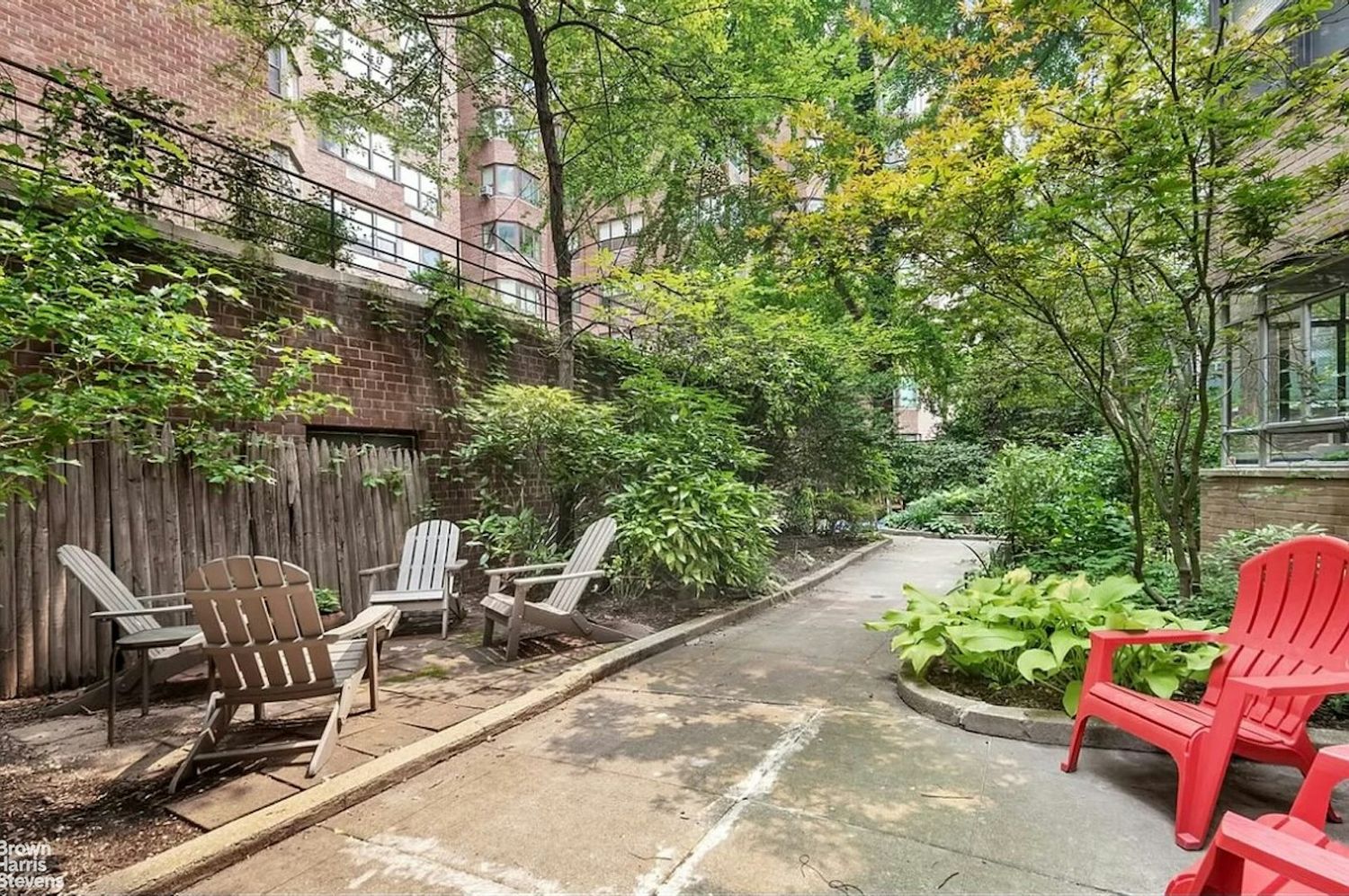 440 East 56th Street, Unit 8C Manhattan, NY 10022 - Photo 10 of 14 a view of a chairs and table in backyard
