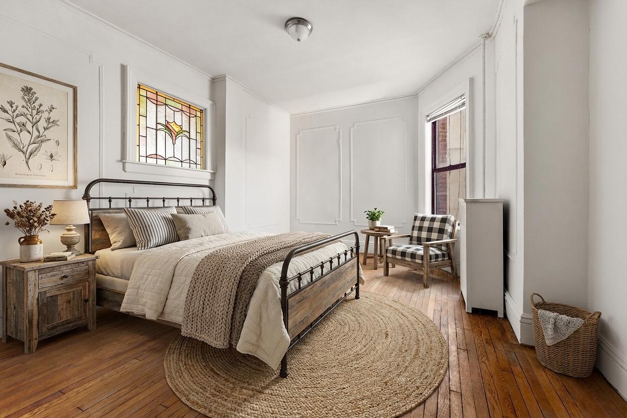 310 Windsor Place, Unit 32 Brooklyn, NY 11218 - Photo 7 of 19 a spacious bedroom with a bed and wooden floor