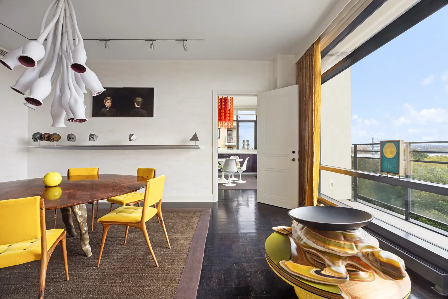 a kitchen with stainless steel appliances kitchen island granite countertop a table and chairs in it