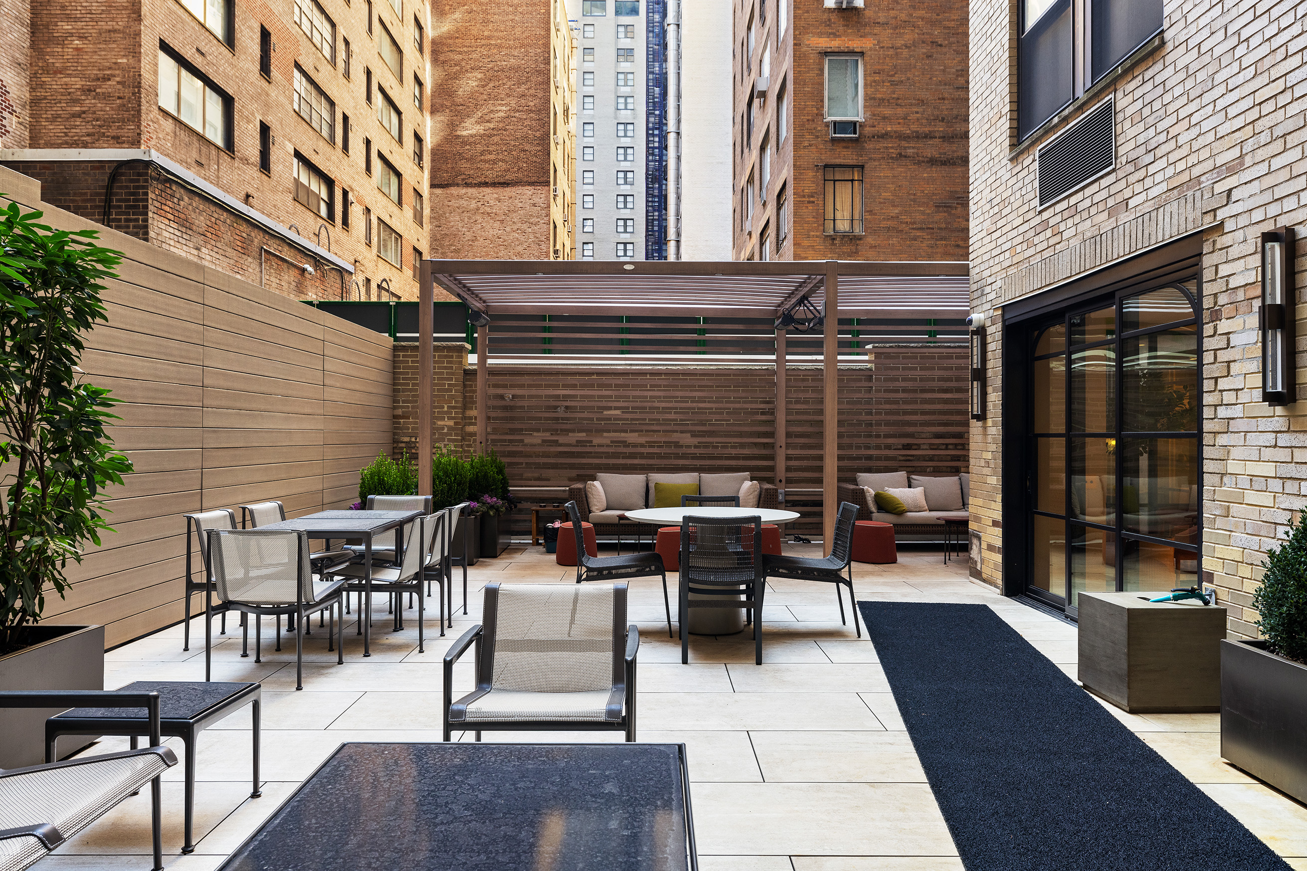 110 Central Park South, Unit PH1 Manhattan, NY 10019 - Photo 22 of 25 a view of a patio with couches table and chairs and potted plants