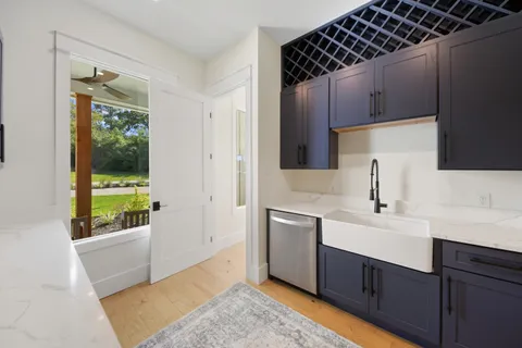 a kitchen with a sink and a refrigerator