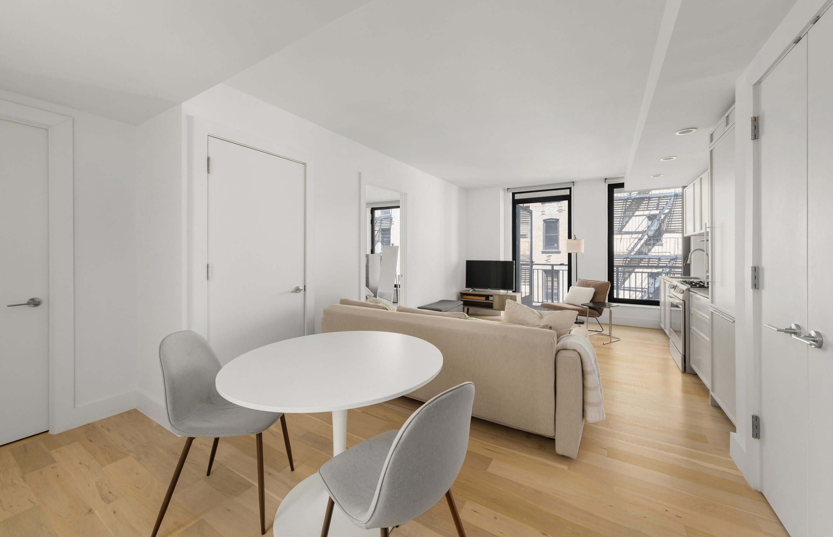 111 Montgomery Street, Unit 5R Brooklyn, NY 11225 - Photo 3 of 12 a living room with furniture a couch and a table