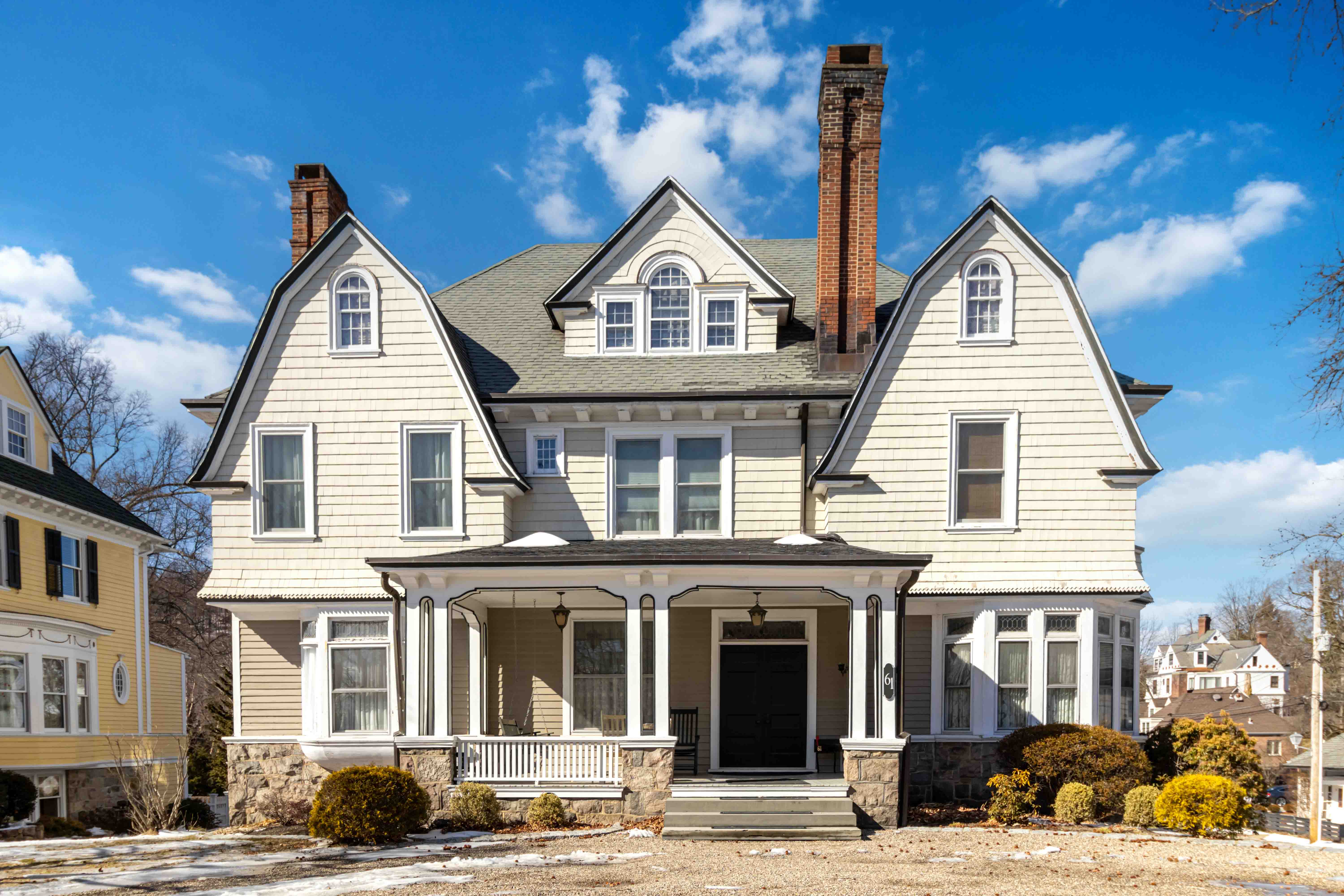 a view of a white building among the street