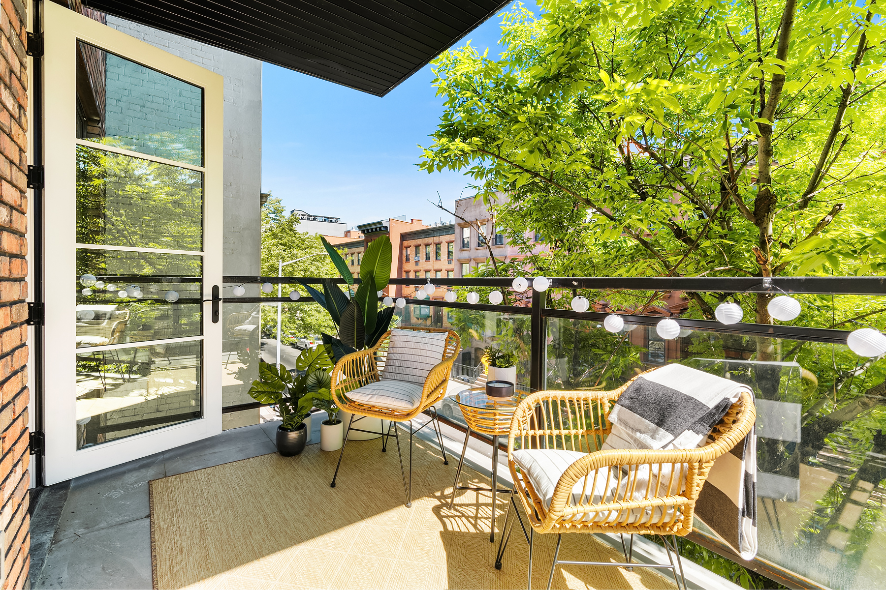 26 West 127th Street, Unit 4A Manhattan, NY 10027 - Photo 6 of 10 a balcony with chairs and with potted plants