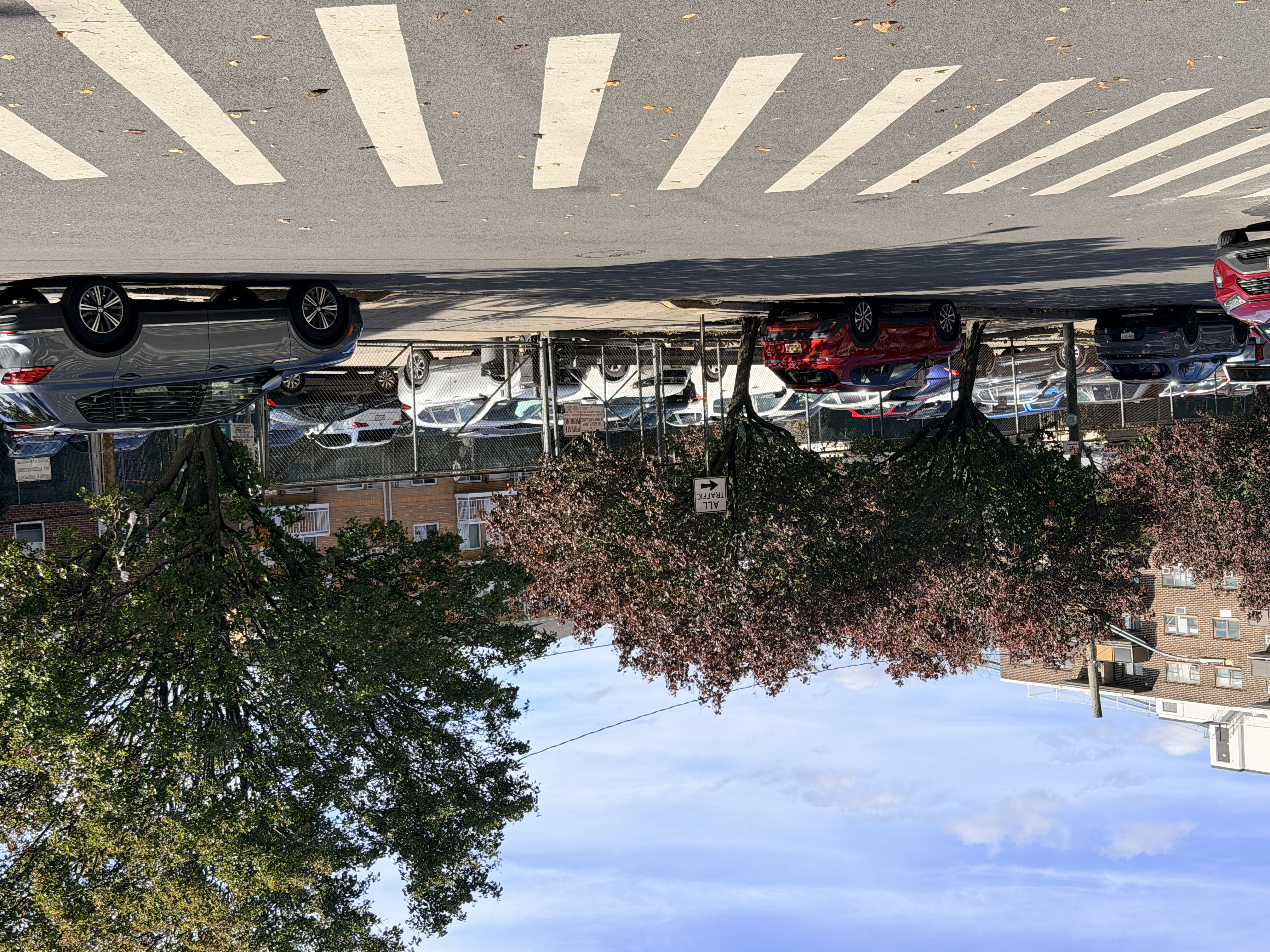 25-40 Shore Boulevard, Unit 15T Queens, NY 11102 - Photo 19 of 22 a view of street with parked cars