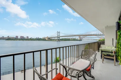 a balcony with outdoor view