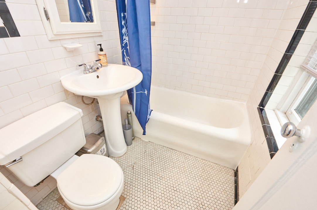 120 East 10th Street, Unit 3 Manhattan, NY 10003 - Photo 6 of 14 a bathroom with a sink toilet and shower