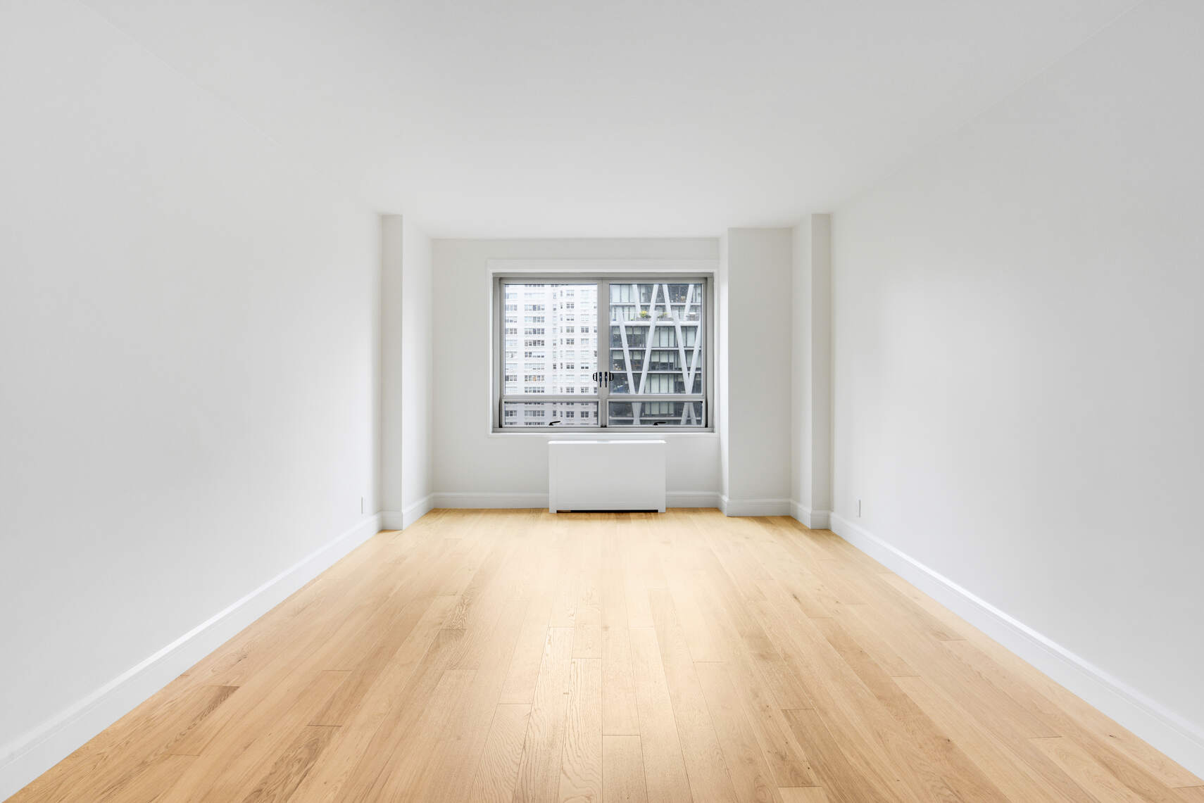 170 West End Avenue, Unit 12B Manhattan, NY 10023 - Photo 9 of 15 an empty room with windows