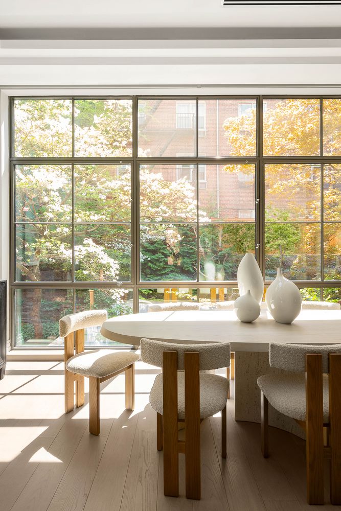 520 East 89th Street Manhattan, NY 10128 - Photo 34 of 40 a view of a dining room with furniture and large windows