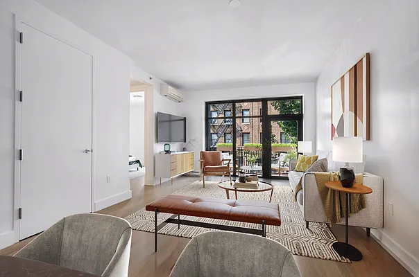 17 Convent Avenue, Unit 3D Manhattan, NY 10027 - Photo 3 of 9 a living room with furniture and a window