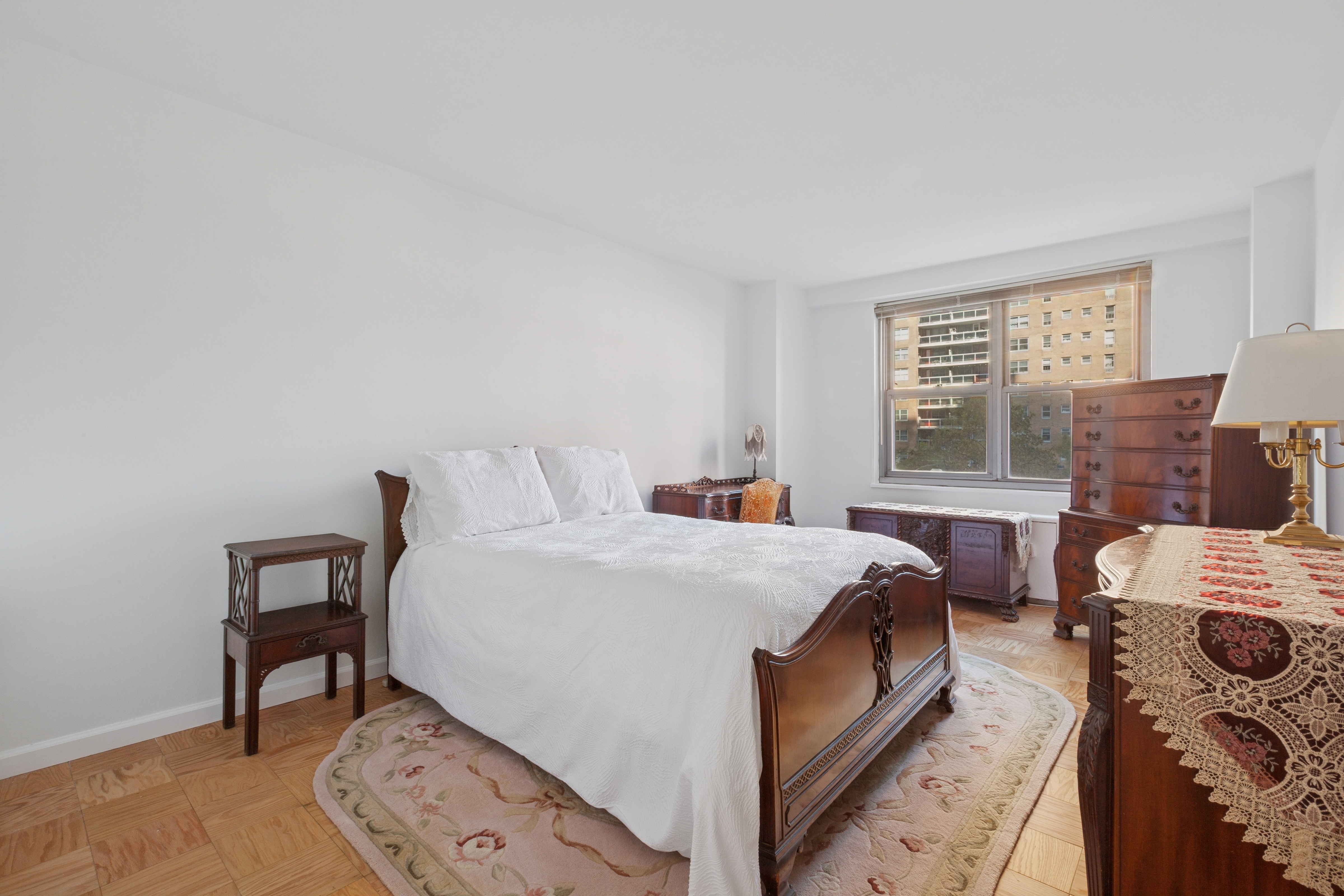 70-25 Yellowstone Boulevard, Unit 2M Queens, NY 11375 - Photo 7 of 23 a bedroom with a bed and a window