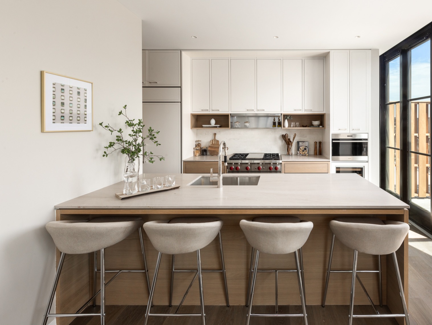 250 West 96th Street, Unit 19D Manhattan, NY 10025 - Photo 5 of 34 a kitchen with a dining table chairs and white cabinets