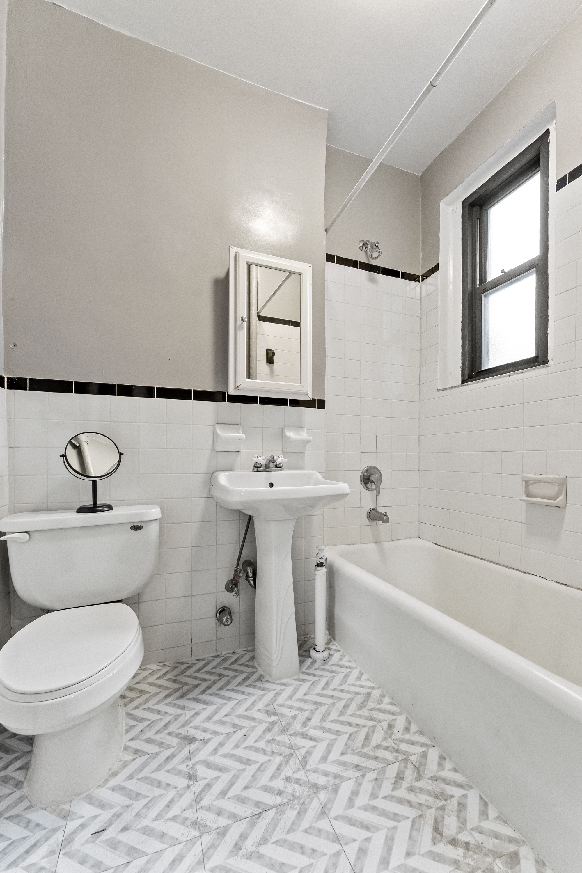 345 East 77th Street, Unit 4I Manhattan, NY 10075 - Photo 4 of 4 a bathroom with a sink toilet and shower
