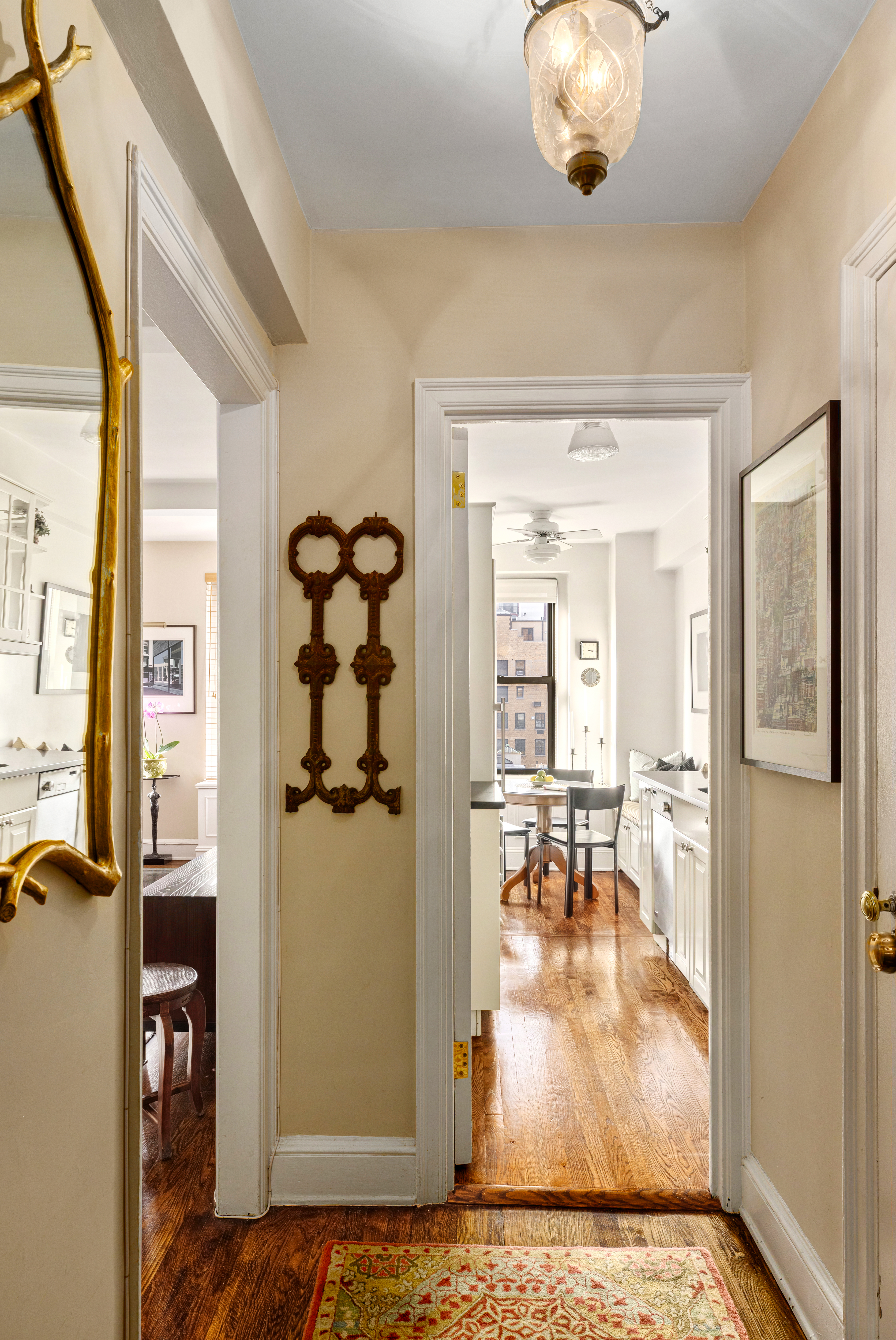 205 East 78th Street, Unit 9F Manhattan, NY 10075 - Photo 2 of 11 a view of a livingroom kitchen and dining room with wooden floor