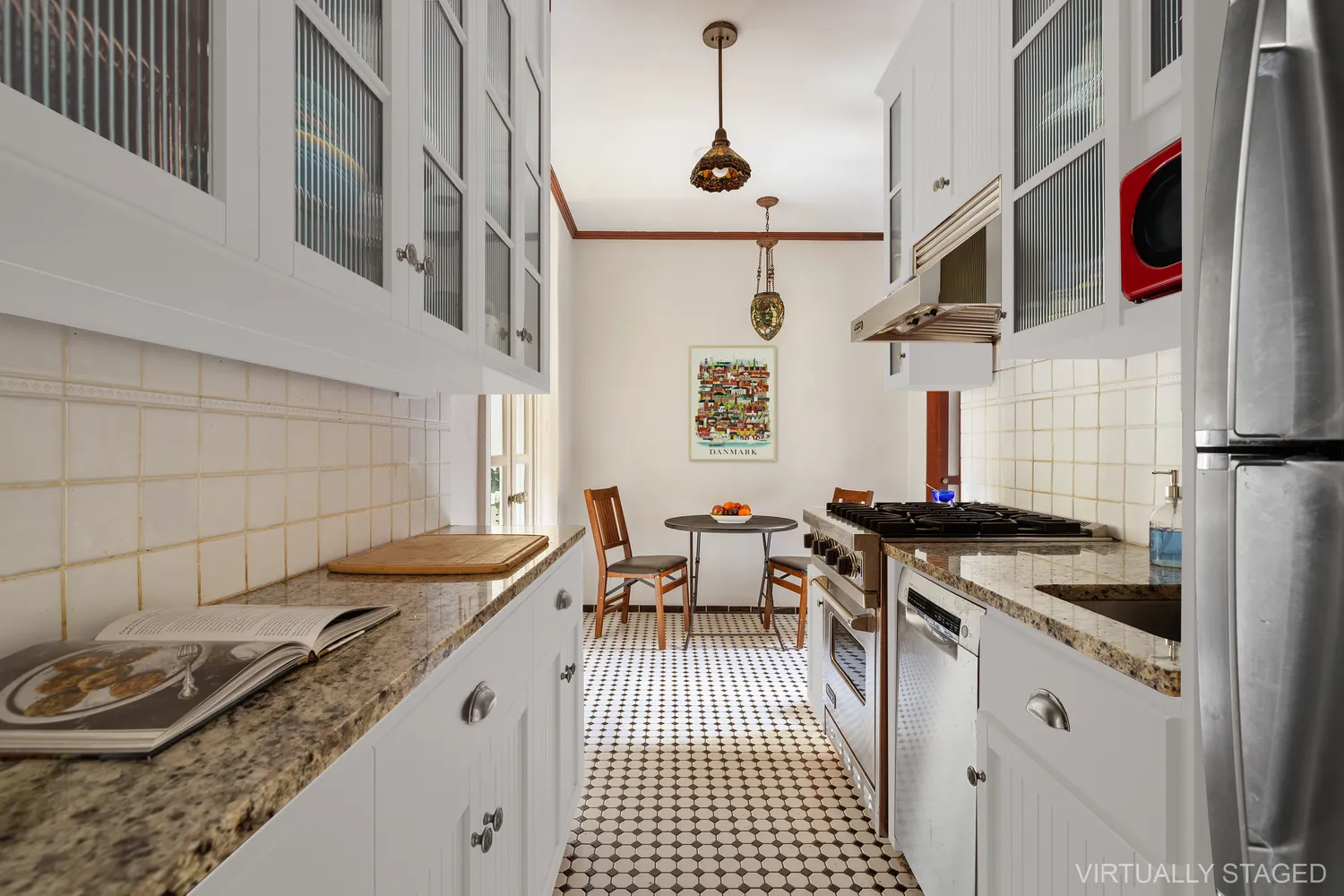 a kitchen with granite countertop a stove and a sink
