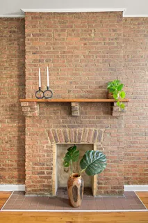 a front view of a house with potted plants