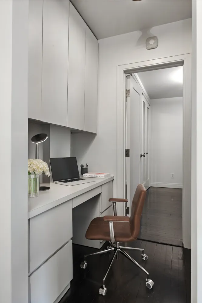 a room with a chair and appliances