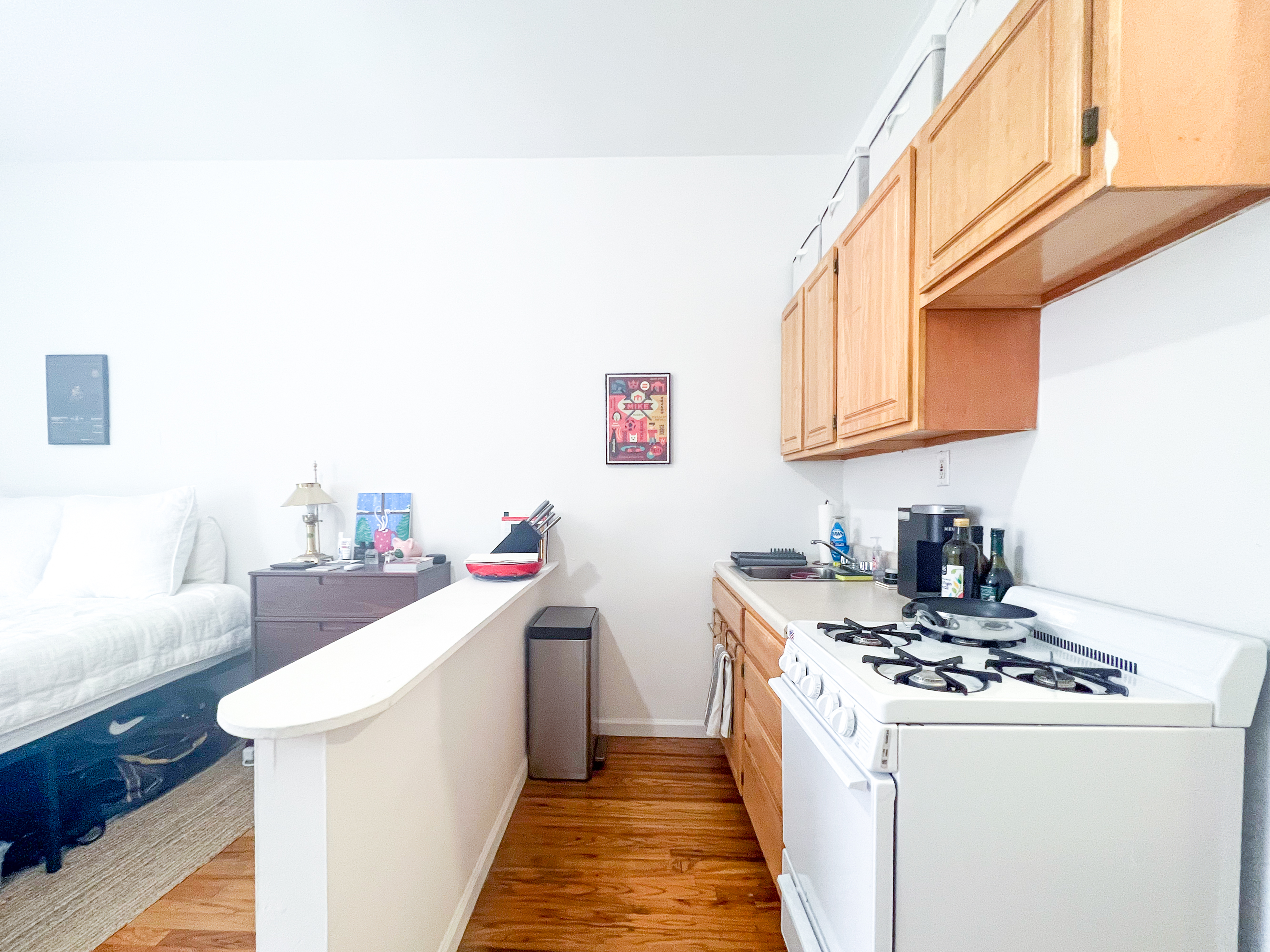 320 West 20th Street, Unit 14 Manhattan, NY 10011 - Photo 4 of 13 a kitchen with a sink and a stove top oven