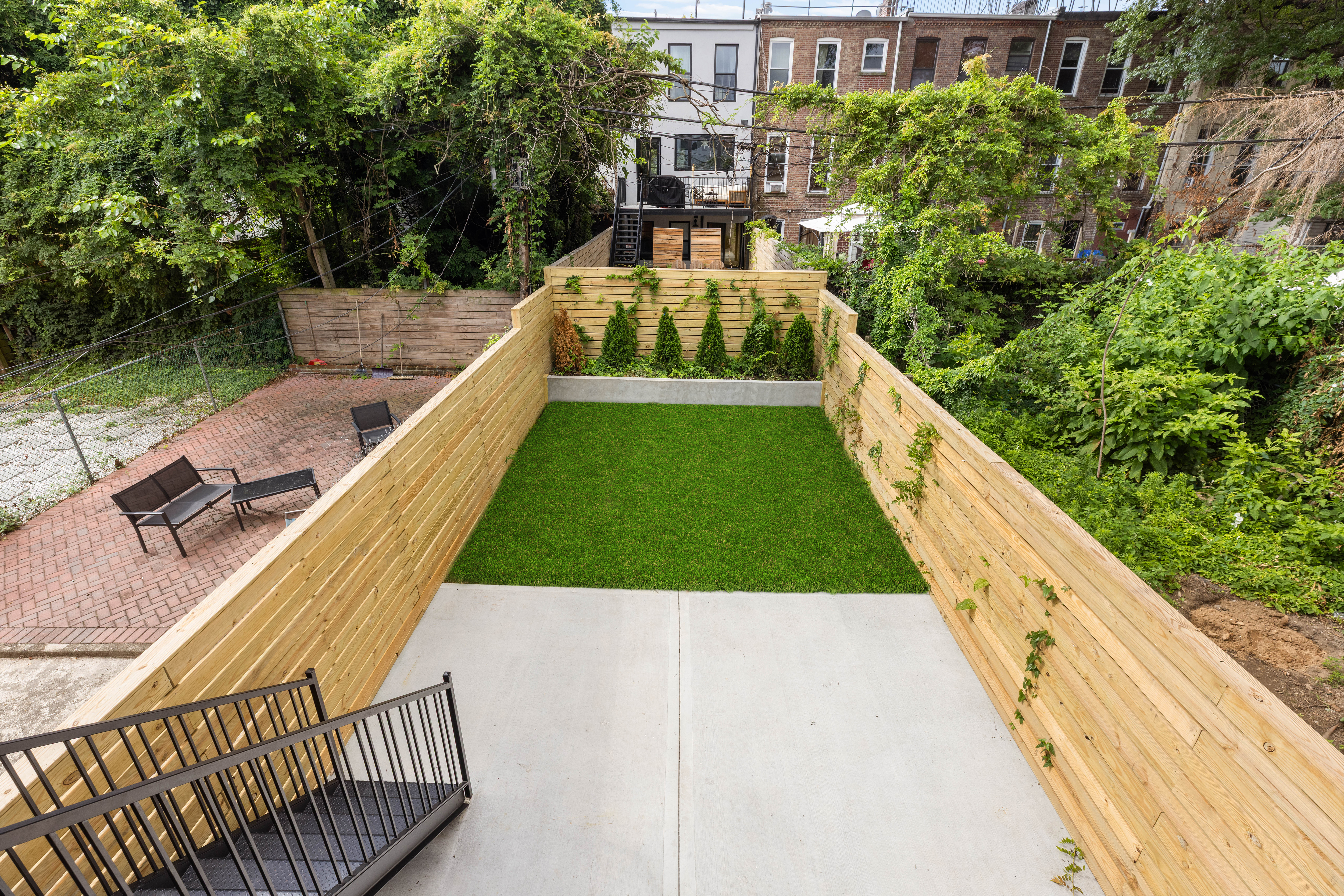 758 Halsey Street Brooklyn, NY 11233 - Photo 13 of 15 a view of a swimming pool with a patio and a yard