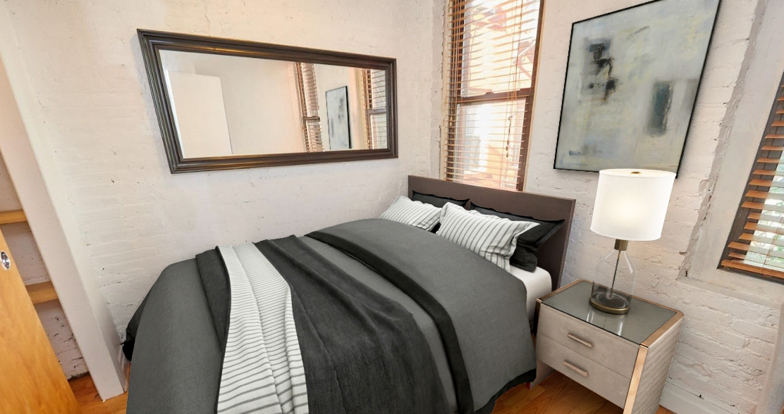170 Elizabeth Street, Unit 1 Manhattan, NY 10012 - Photo 9 of 16 a bedroom with a bed and a window