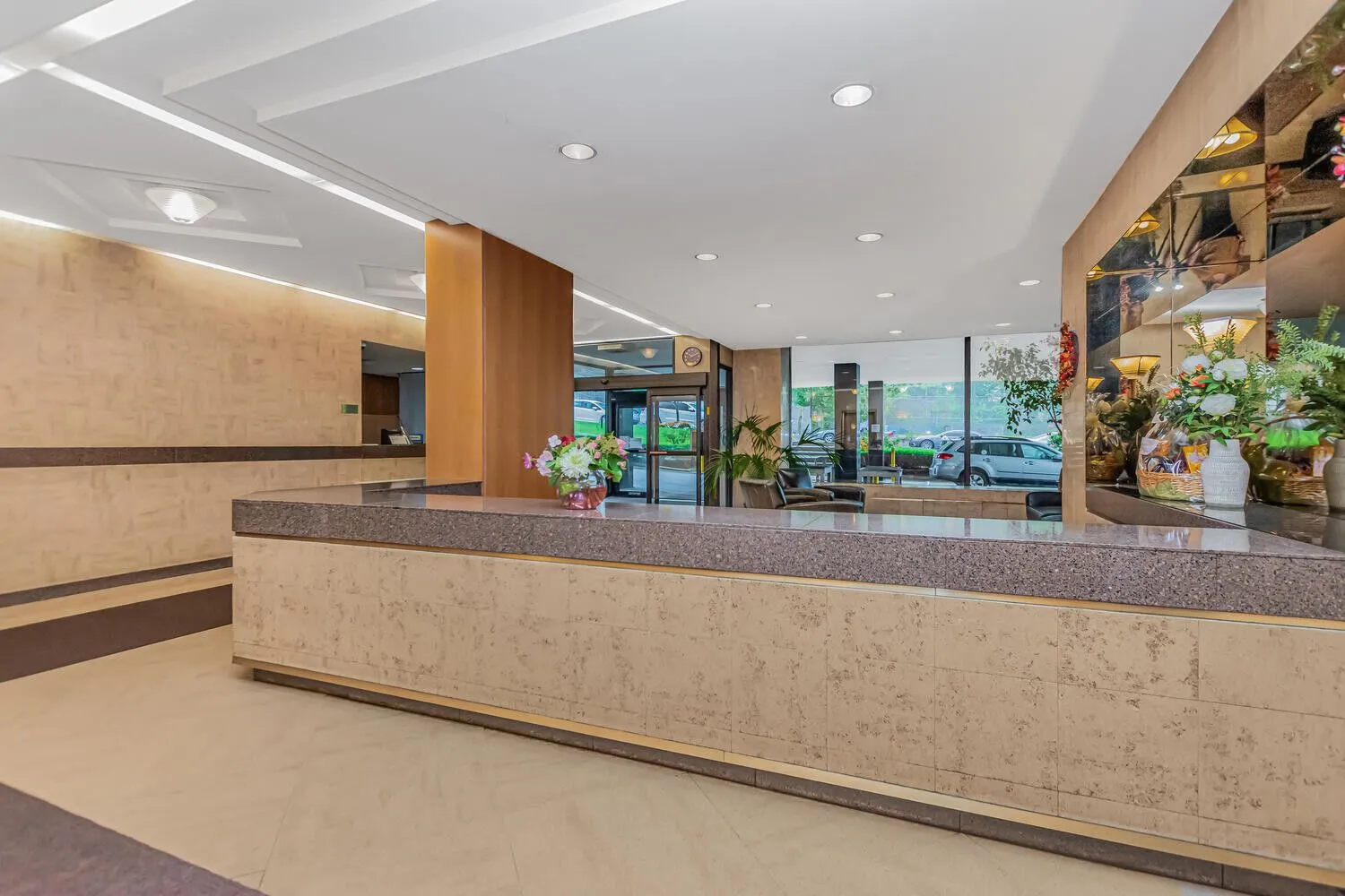 a kitchen with stainless steel appliances granite countertop a stove and white cabinets