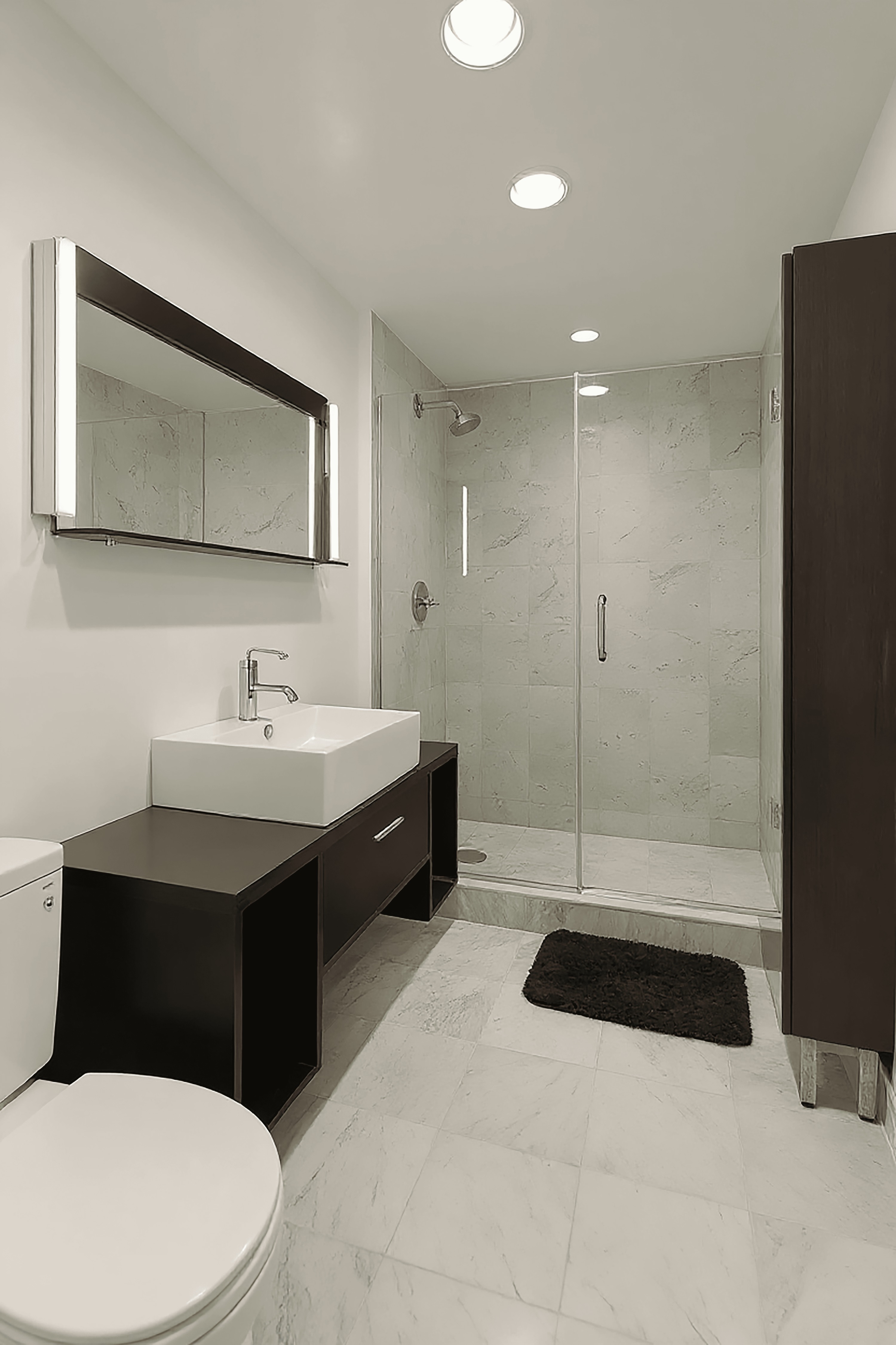 257 West 117th Street, Unit 2G Manhattan, NY 10026 - Photo 6 of 11 a bathroom with a sink a toilet and mirror