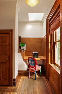 a view of a hallway with furniture and front door