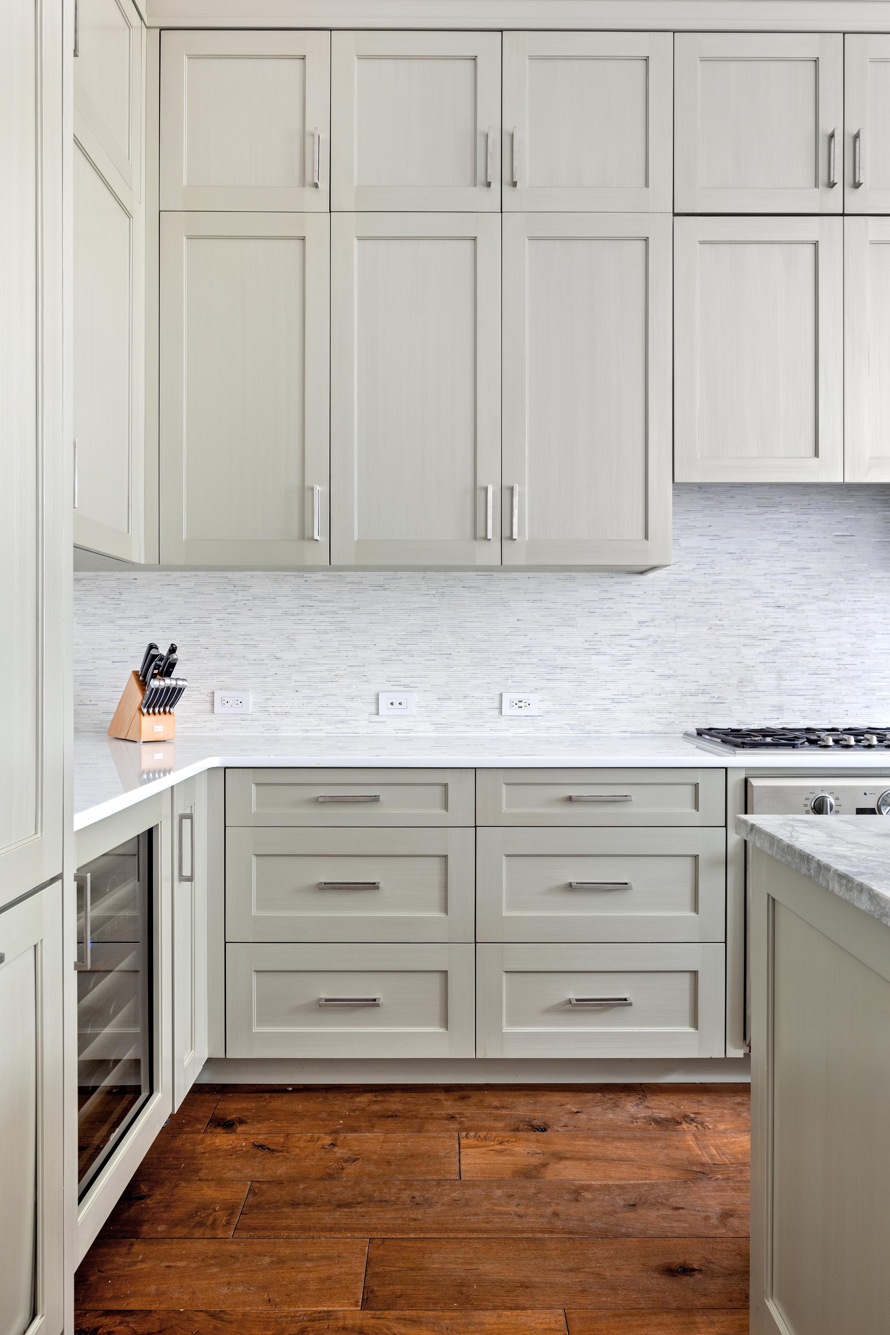 14 West 11th Street, Unit GARDEN Manhattan, NY 10011 - Photo 4 of 18 a kitchen with granite countertop cabinets and white appliances