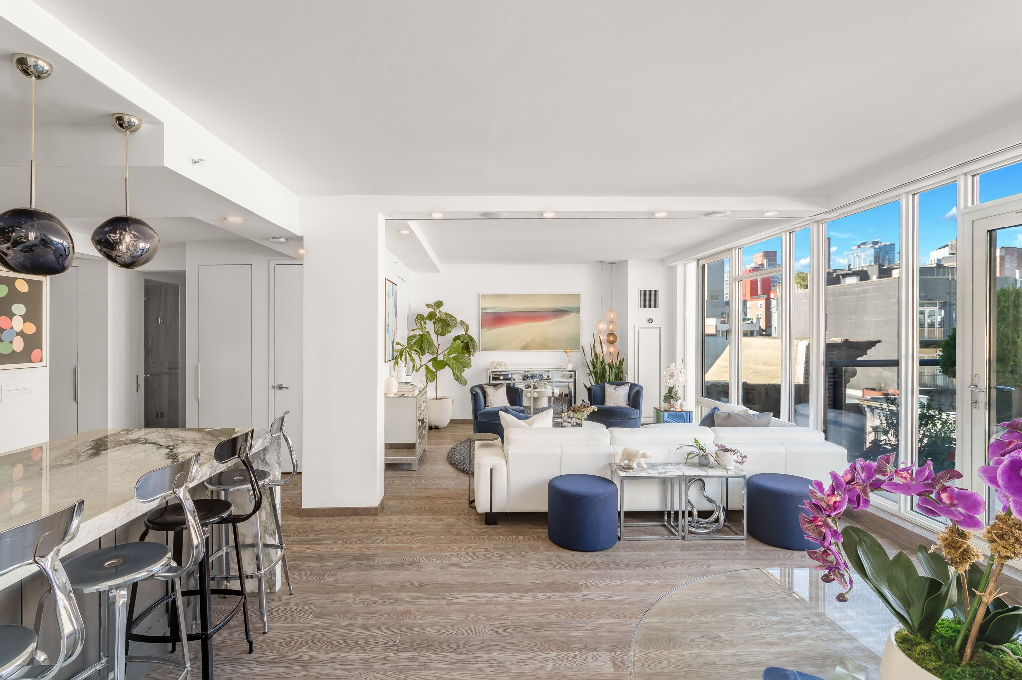 350 West 53rd Street, Unit PHB Manhattan, NY 10019 - Photo 5 of 34 a living room with lots of furniture and chandelier
