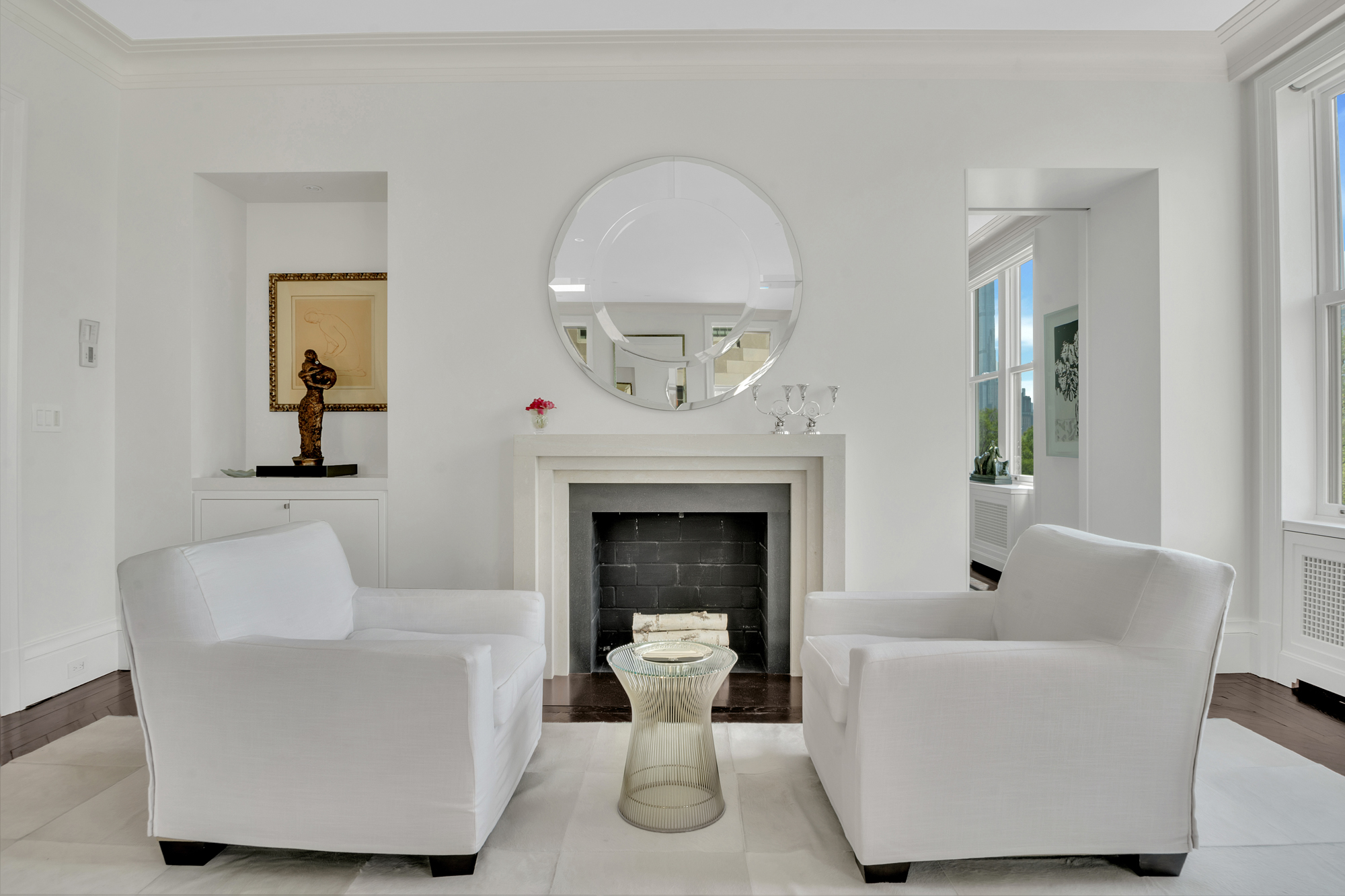 988 5th Avenue Manhattan, NY 10075 - Photo 7 of 14 a living room with furniture and a fireplace