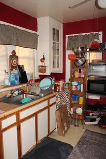 a bedroom with a bed and dresser