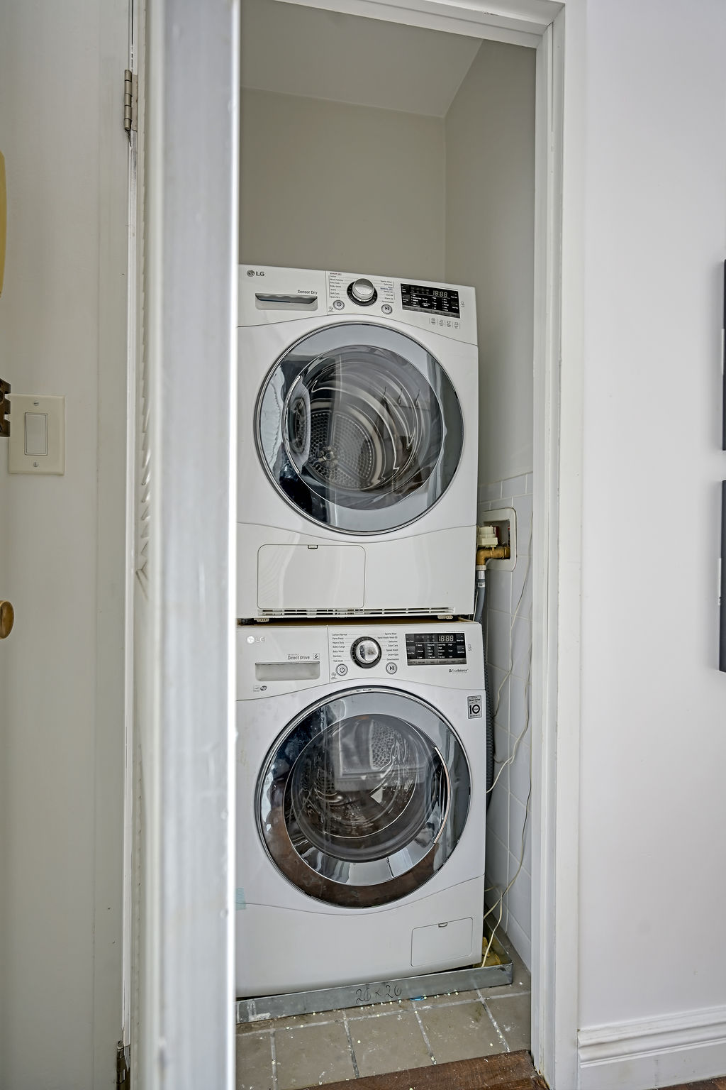 300 East 74th Street, Unit 6D Manhattan, NY 10021 - Photo 8 of 12 a utility room with dryer and washer