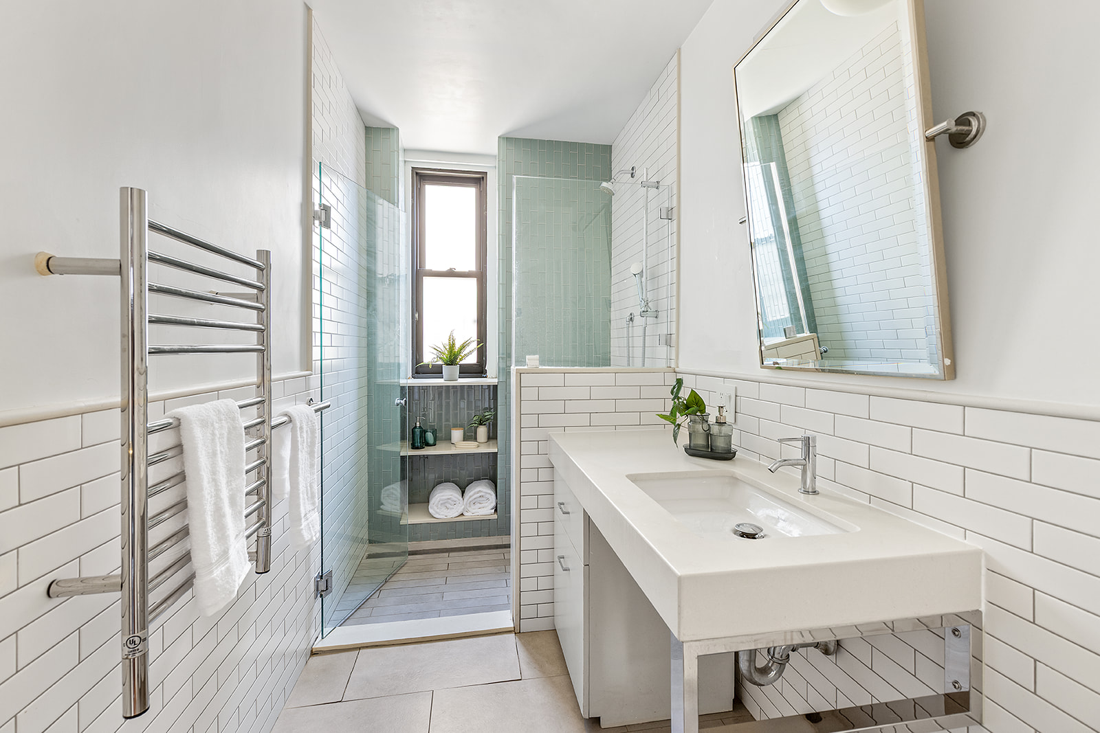 135 Eastern Parkway, Unit 14E Brooklyn, NY 11238 - Photo 11 of 16 a bathroom with a sink and a mirror