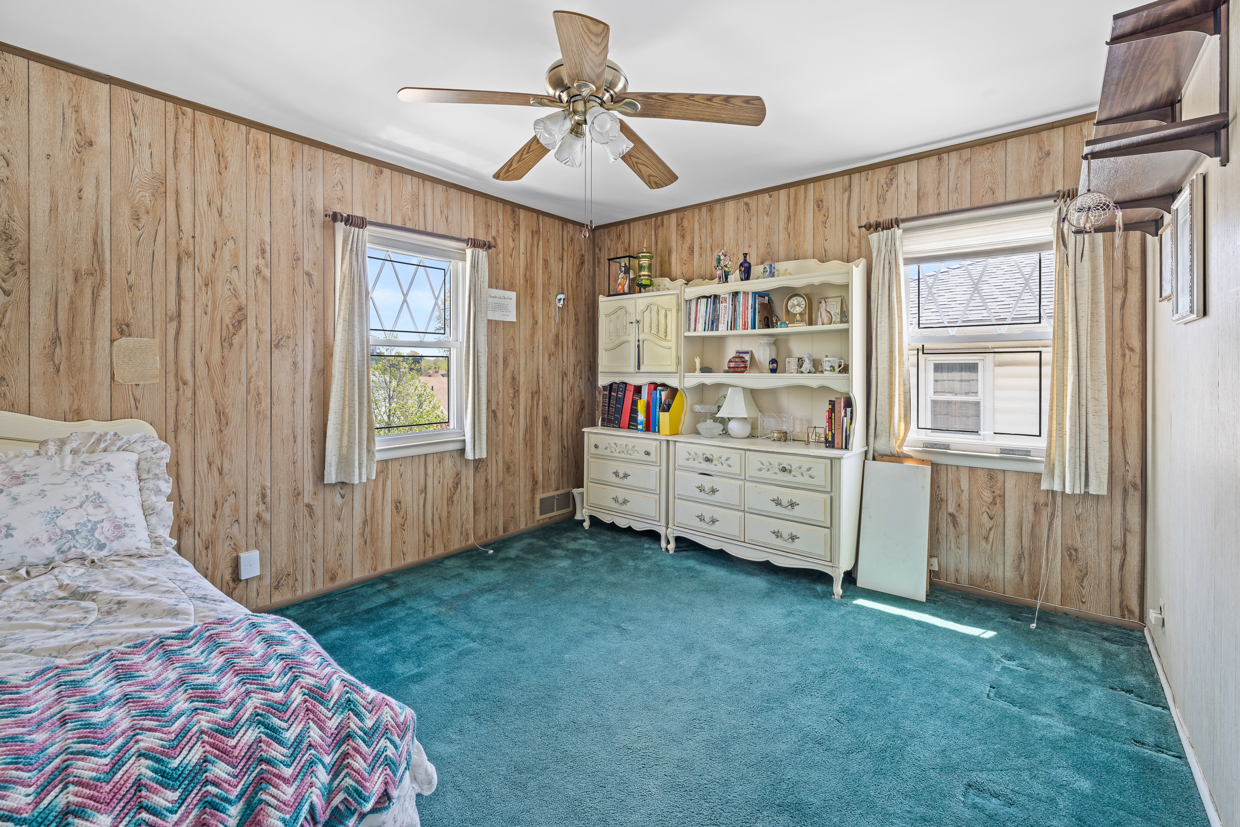 14-28 140th Street Queens, NY 11357 - Photo 8 of 14 a bedroom with a bed closet and a window