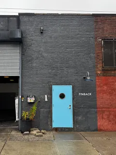 a bathroom with a potted plant