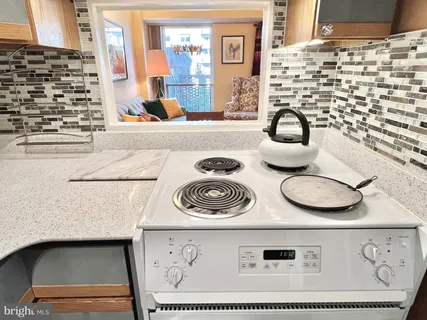 a kitchen with a stove and a microwave