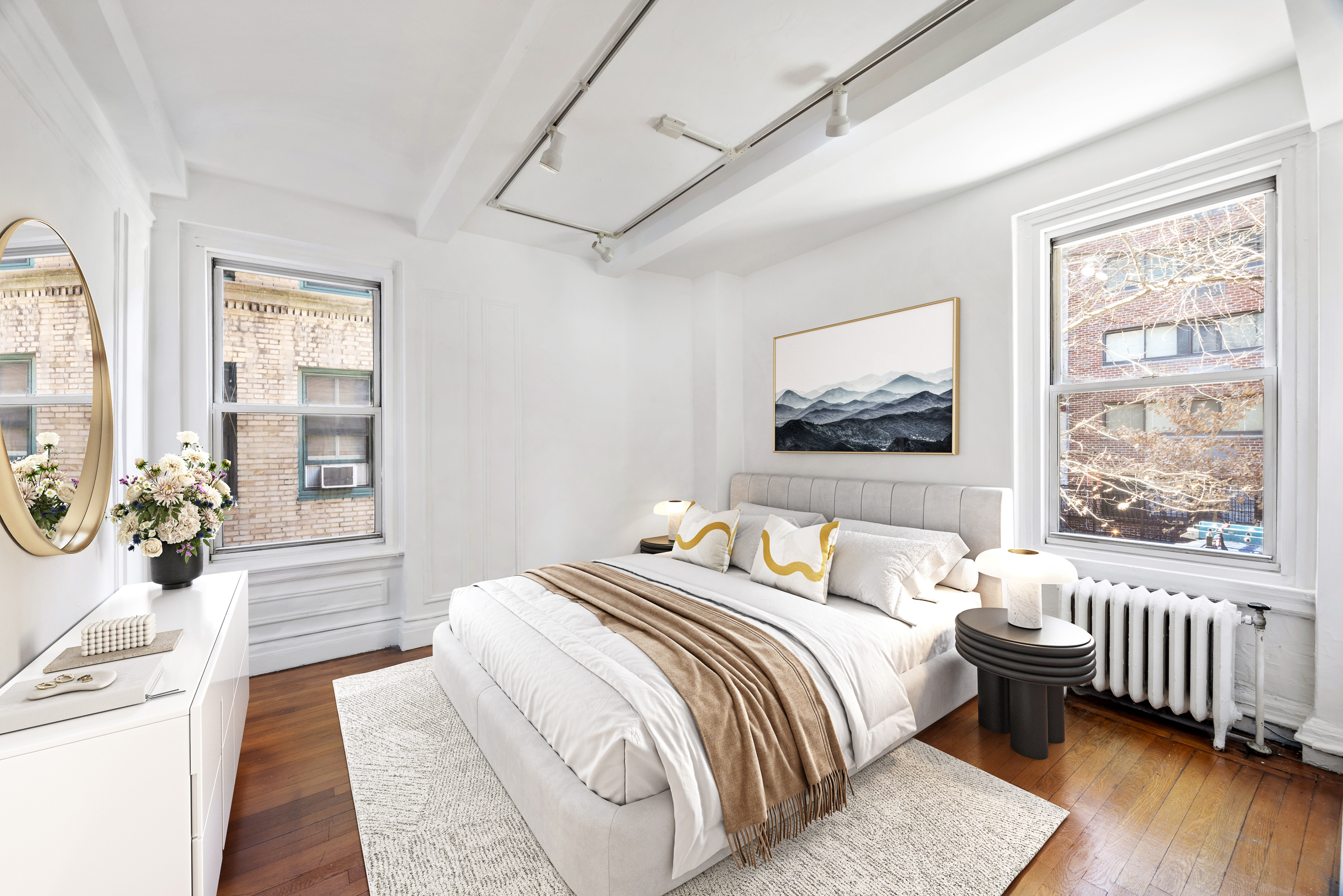 325 West 45th Street, Unit 205 Manhattan, NY 10036 - Photo 7 of 14 a bedroom with a large bed and windows