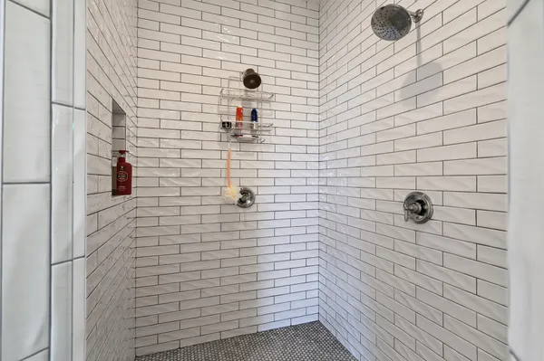 a bedroom with a bed and a table in it