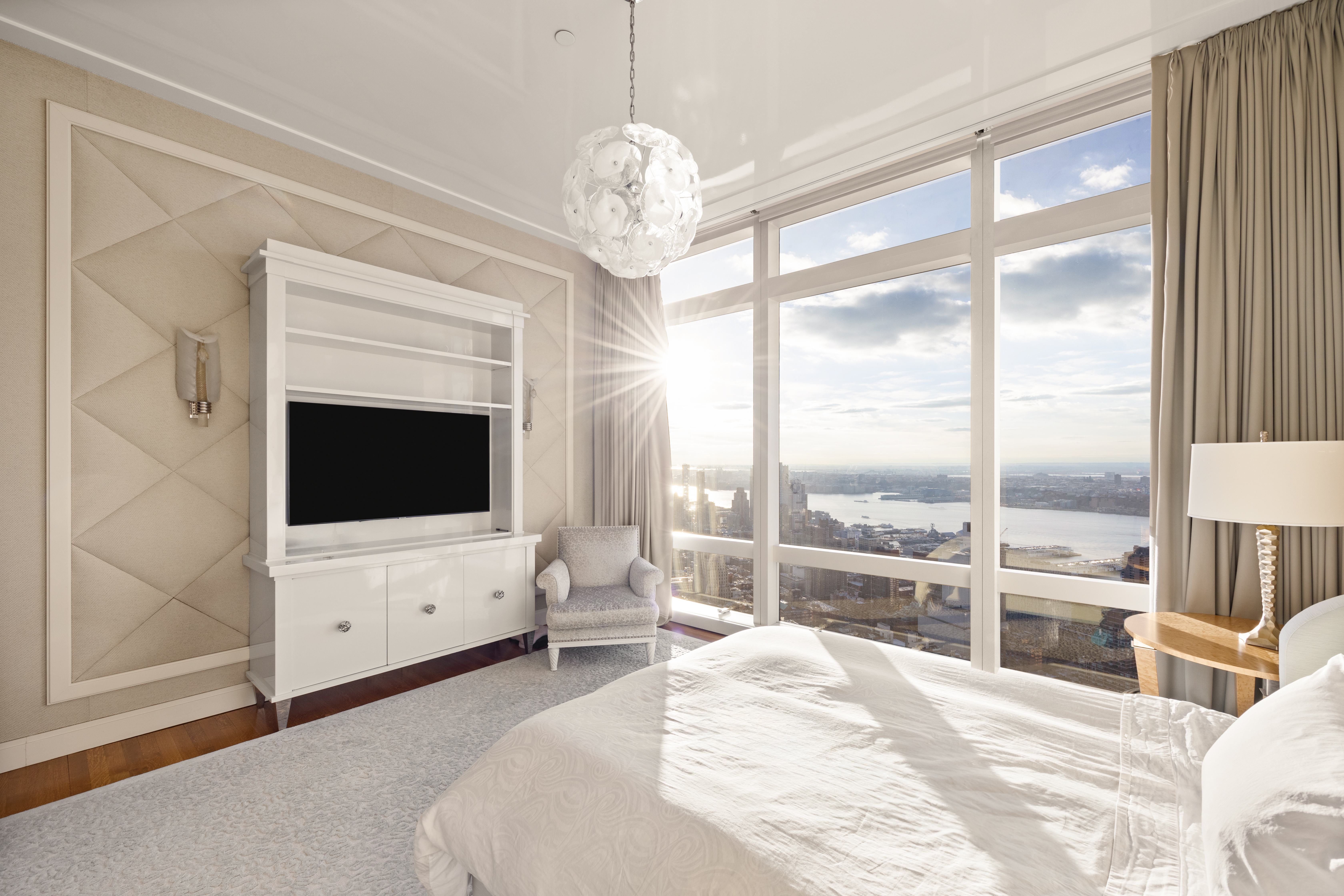 25 Columbus Circle, Unit 75A Manhattan, NY 10019 - Photo 18 of 36 a bedroom with a bed and a flat screen tv