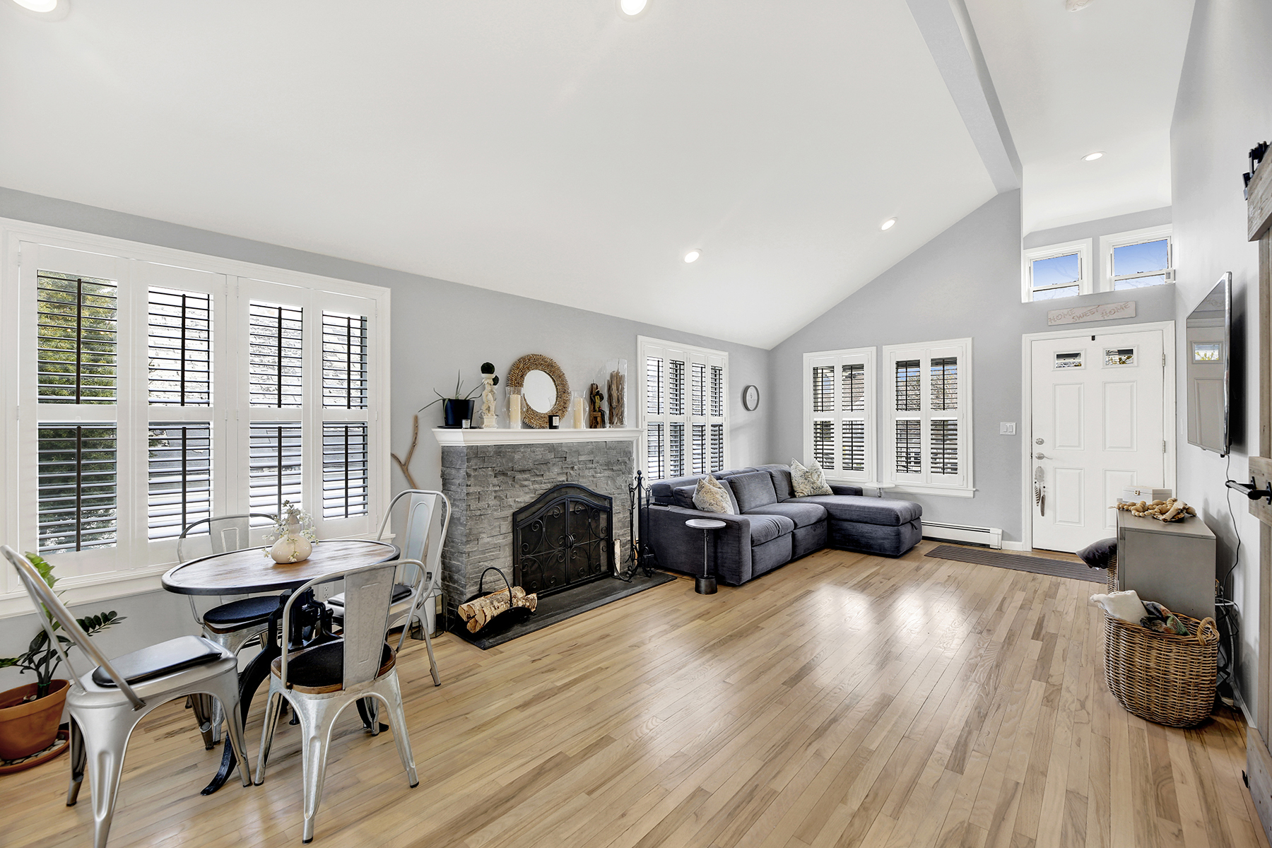 4-53 Beach 142nd Street Queens, NY 11694 - Photo 10 of 39 a living room with furniture and a fireplace