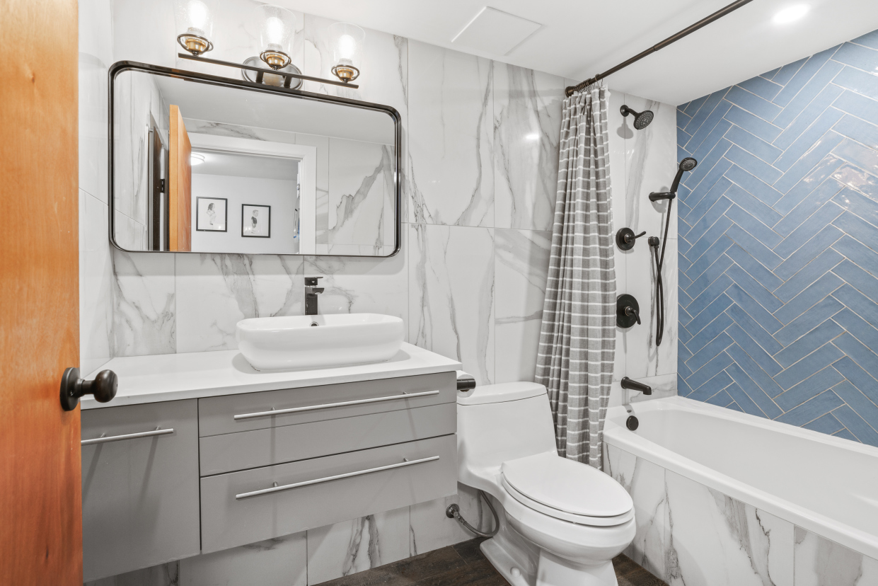 95 Vanderbilt Avenue, Unit AA Brooklyn, NY 11205 - Photo 6 of 11 a bathroom with a sink toilet and shower