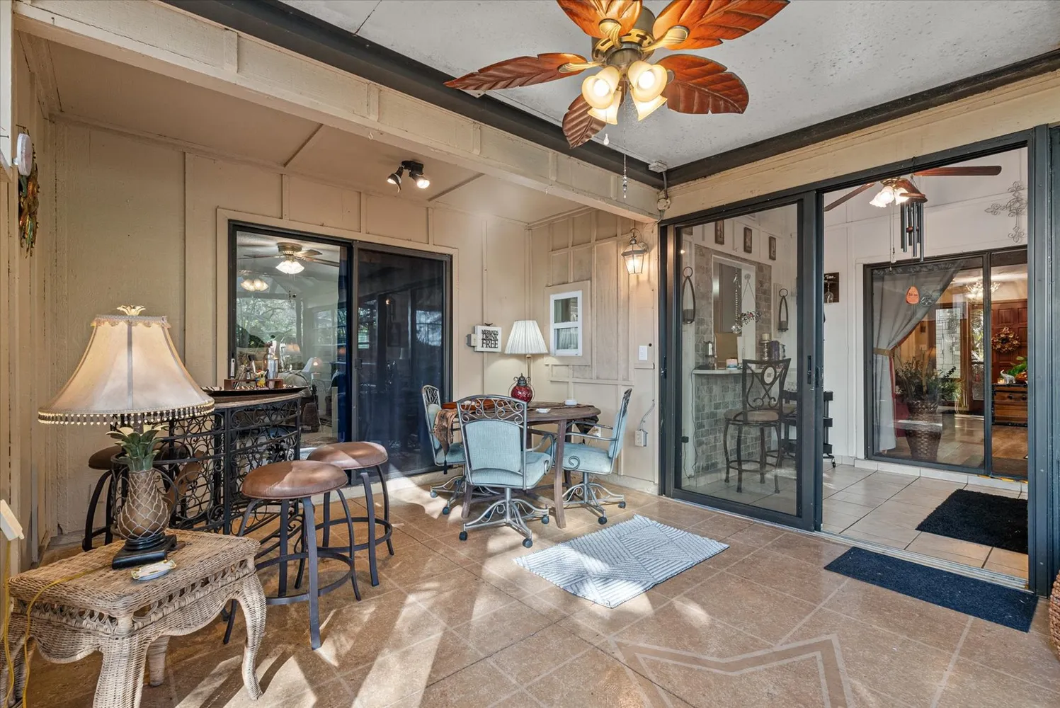 a building outdoor space with patio furniture and potted plants