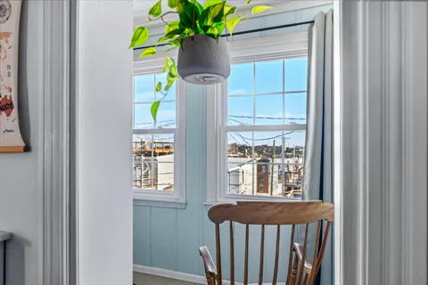 a bedroom with furniture and a window