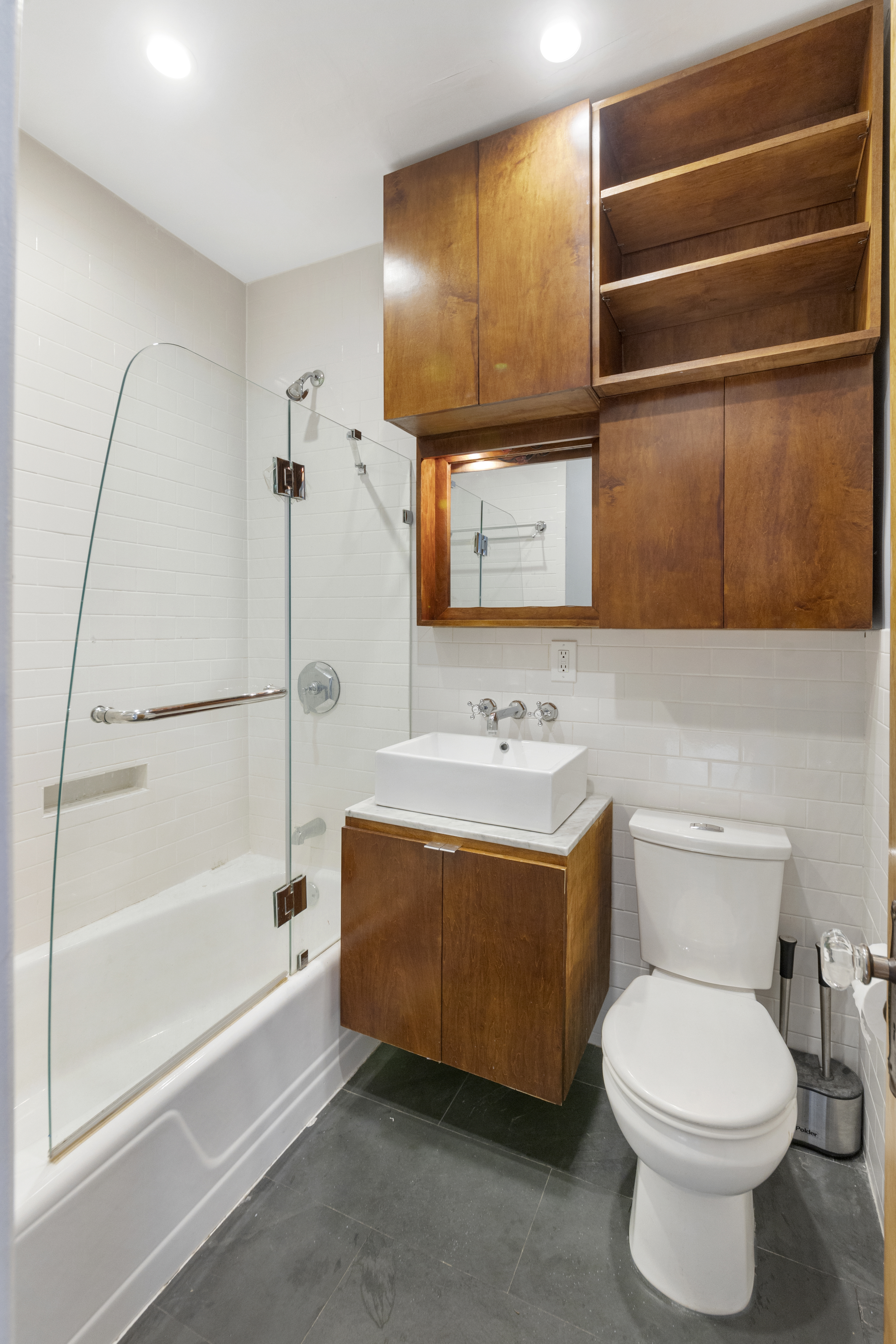 57 Hendrix Street, Unit 1 Brooklyn, NY 11207 - Photo 12 of 12 a bathroom with a sink toilet and shower