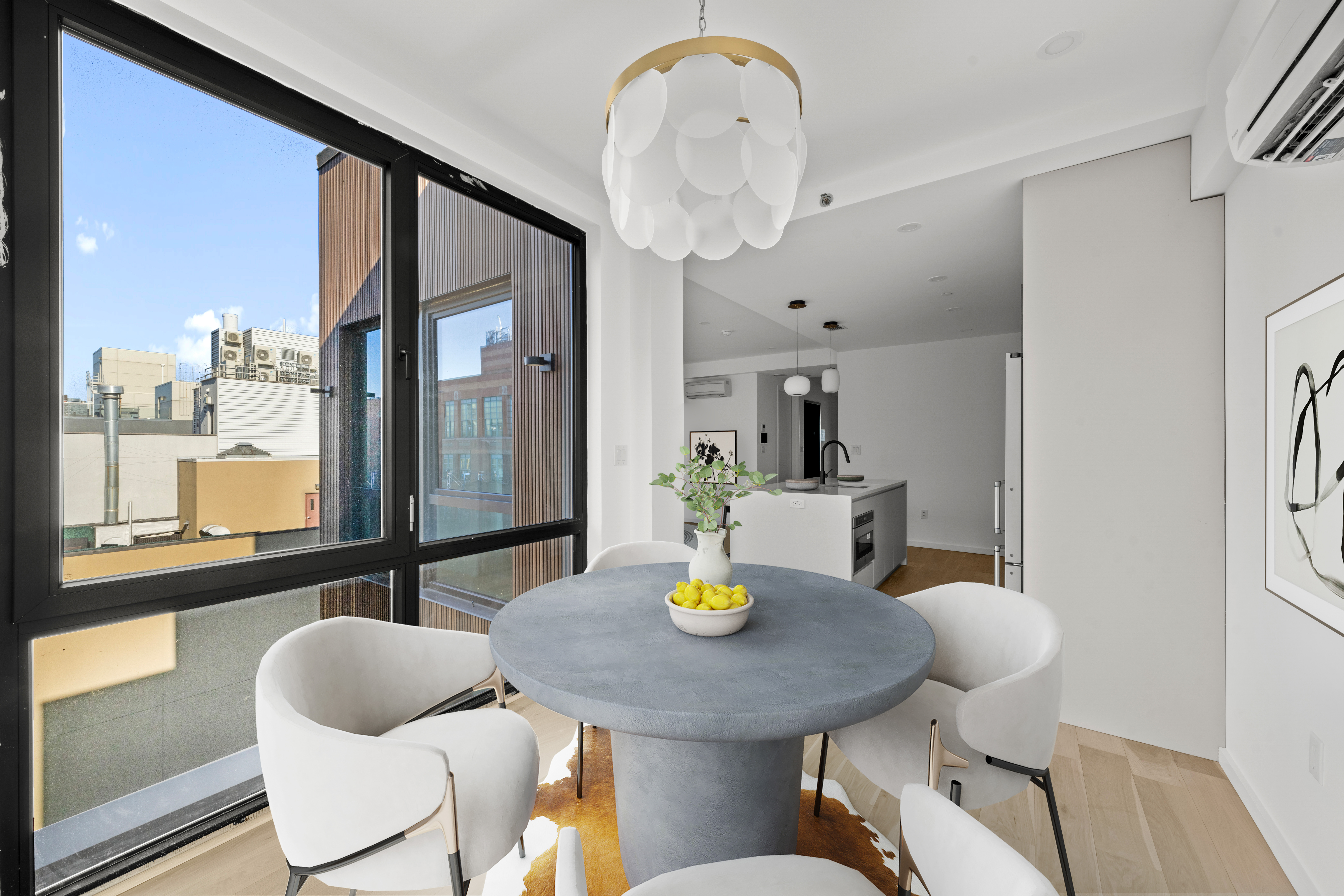 14-35 Broadway, Unit PH Queens, NY 11106 - Photo 8 of 24 a dining room with furniture and window