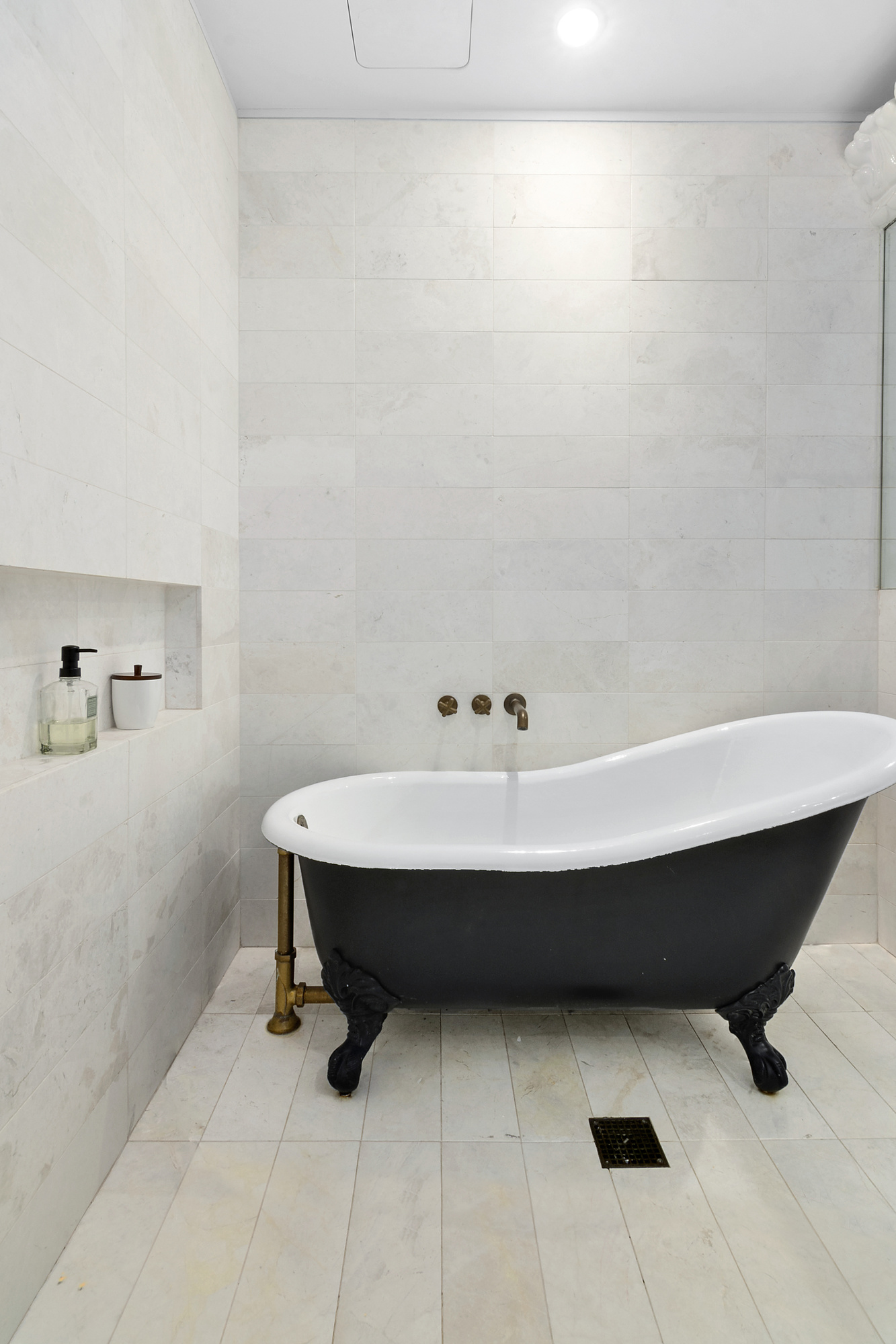 93 Worth Street, Unit 1006 Manhattan, NY 10013 - Photo 10 of 18 a bathroom with a sink and mirror