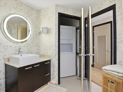 a en suite bathroom with a sink a mirror and a shower