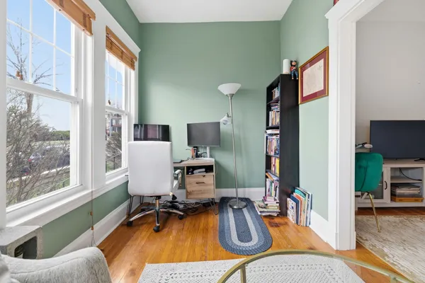 a view of a livingroom with furniture and a flat screen tv